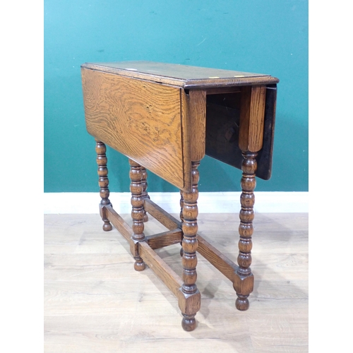 361 - An oak Sutherland Table mounted on bobbin turned supports 2ft 8in W x 2ft 4in H