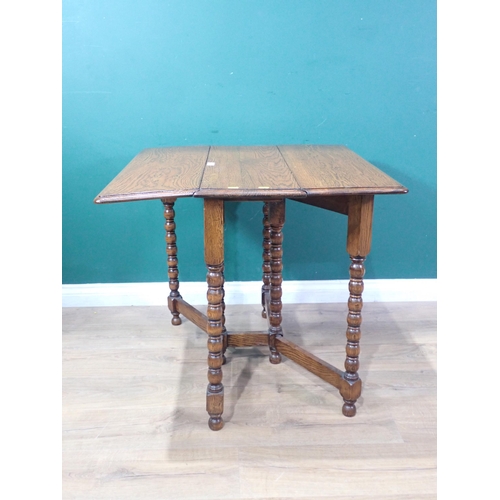 361 - An oak Sutherland Table mounted on bobbin turned supports 2ft 8in W x 2ft 4in H