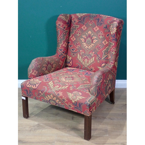 364 - A Georgian style wingback Armchair with stylised floral decoration on red ground mounted on square c... 