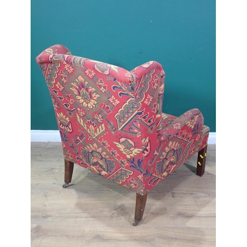 364 - A Georgian style wingback Armchair with stylised floral decoration on red ground mounted on square c... 