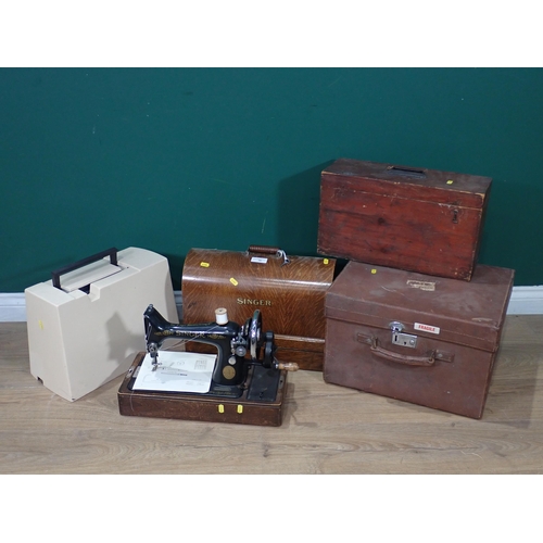 398 - Two Singer Sewing Machines, a Husqvarna Sewing Machine, a Dressing Case and a stained pine Box