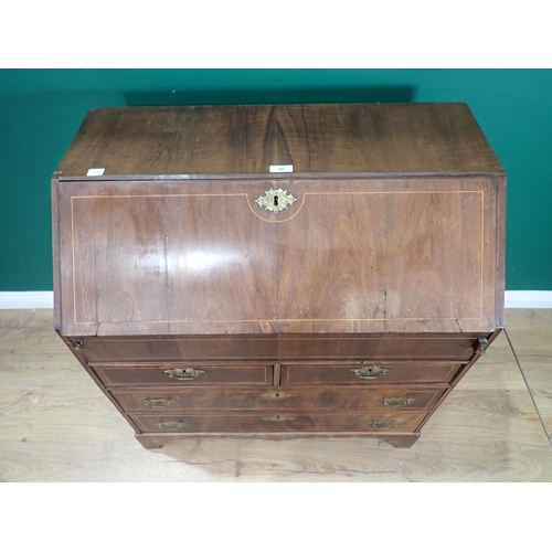 40 - A Georgian walnut and boxwood strung Bureau with fall front enclosing fitted interior of drawers, cu... 