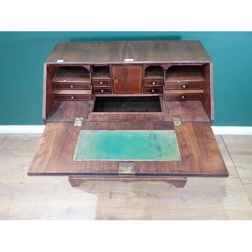 40 - A Georgian walnut and boxwood strung Bureau with fall front enclosing fitted interior of drawers, cu... 
