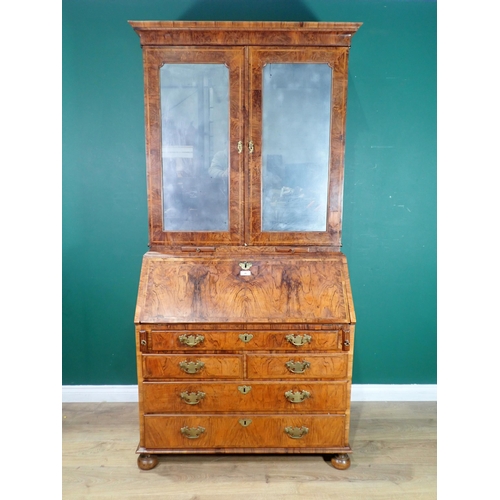 46 - An 18th Century walnut Bureau Bookcase, the moulded cornice above a pair of mirrored doors and candl... 