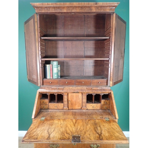46 - An 18th Century walnut Bureau Bookcase, the moulded cornice above a pair of mirrored doors and candl... 