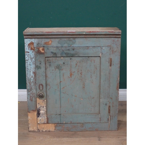 504 - An antique elm blue painted Wall Cupboard the single door enclosing fixed shelves A/F 2ft 1in H x 1f... 