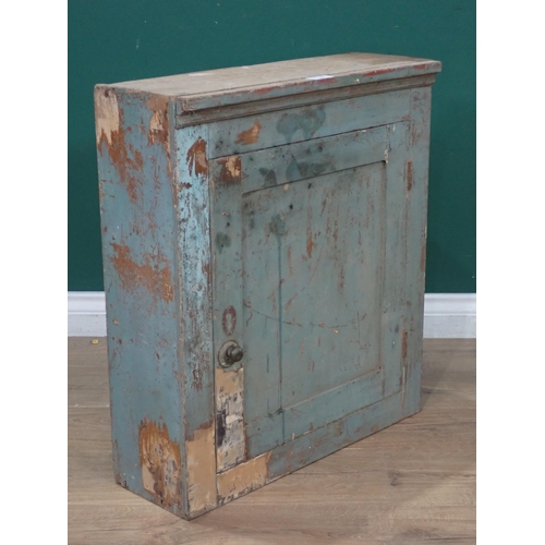 504 - An antique elm blue painted Wall Cupboard the single door enclosing fixed shelves A/F 2ft 1in H x 1f... 