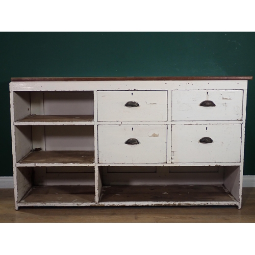 505 - An antique white painted Shop Counter with mahogany top, panelled front, fitted with four drawers an... 