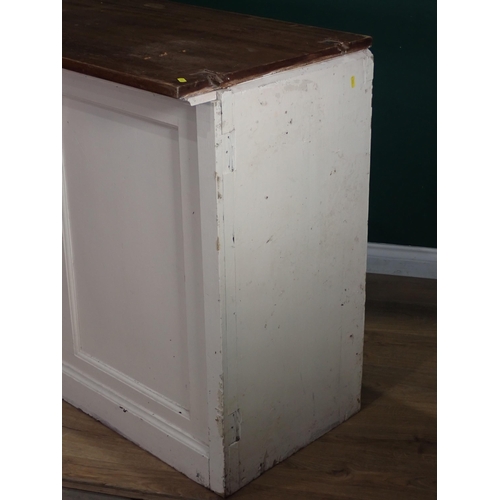 505 - An antique white painted Shop Counter with mahogany top, panelled front, fitted with four drawers an... 