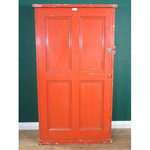 508 - A red painted pine Cupboard with panelled door, fitted four shelves. 5ft H x 2ft 11