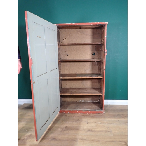 508 - A red painted pine Cupboard with panelled door, fitted four shelves. 5ft H x 2ft 11