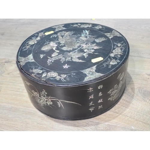 510 - An antique Chinese rosewood and mother of pearl inlaid circular Box with designs of butterflies and ... 