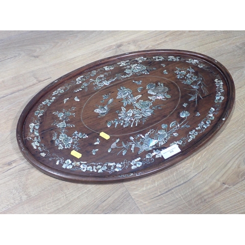 510 - An antique Chinese rosewood and mother of pearl inlaid circular Box with designs of butterflies and ... 