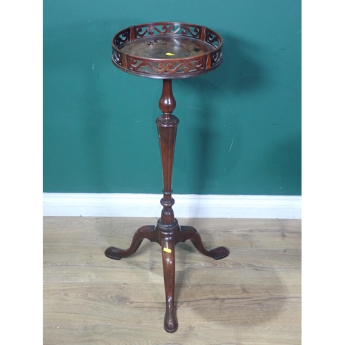 71 - A Georgian mahogany Torchere with pierced frieze mounted on turned column and tripod base A/F 2ft 10... 