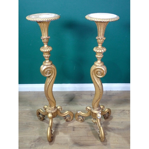 73 - A pair of antique gilded Torcheres of urn form upon scroll columns and tripod bases A/F 3ft 6in H x ... 