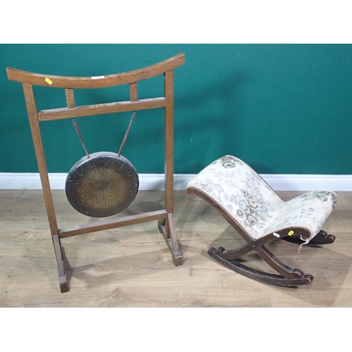 77 - A Dinner Gong with oak frame 3ft H x 2ft W and a mahogany Gout Stool 2ft 11in W x 1ft 2in H