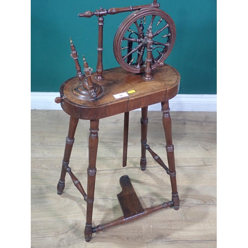 82 - A 19th Century mahogany Spinning Wheel on turned supports 4ft 1in H x 1ft 6in W