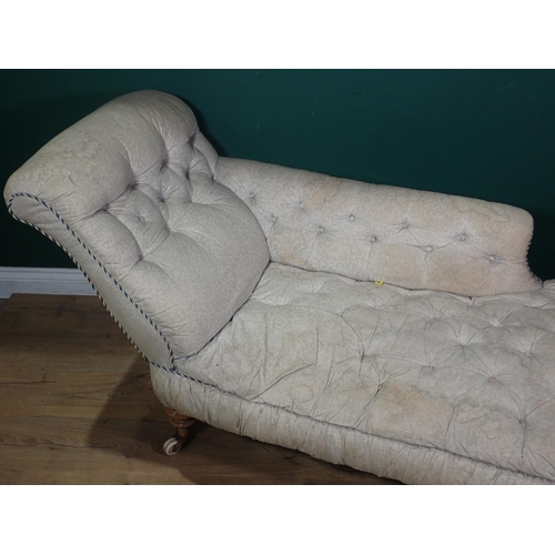 86 - A 19th Century Chaise Lounge with white floral button upholstery mounted upon beech turned supports ... 