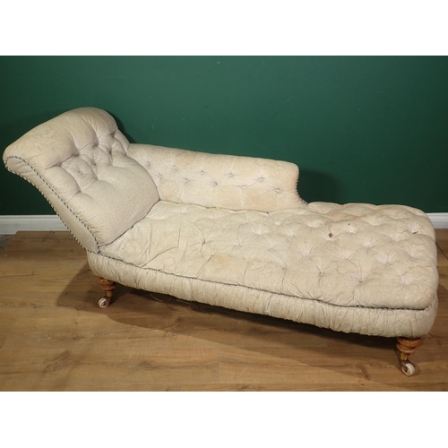 86 - A 19th Century Chaise Lounge with white floral button upholstery mounted upon beech turned supports ... 