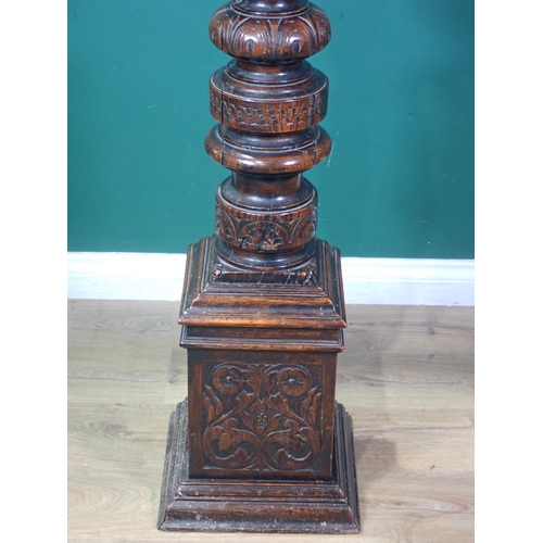 87 - An antique oak Torchere with leafage carved and gadrooned turned column on square base 4ft 7in H x 1... 