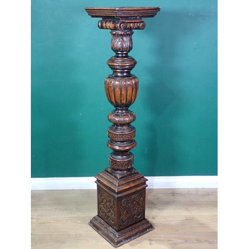 87 - An antique oak Torchere with leafage carved and gadrooned turned column on square base 4ft 7in H x 1... 