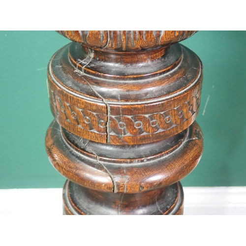 87 - An antique oak Torchere with leafage carved and gadrooned turned column on square base 4ft 7in H x 1... 