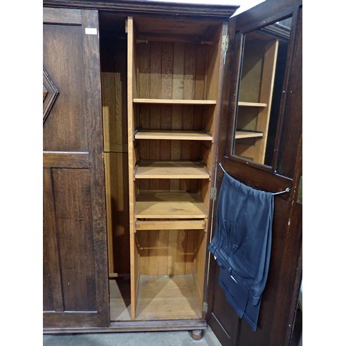 525 - An oak two door Wardrobe on turned supports 5ft 9in H x 3ft 9in W