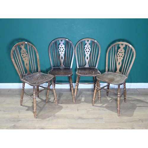 520 - A 19th Century mahogany fold over Card Table on later turned supports, four wheelback Kitchen Chairs... 