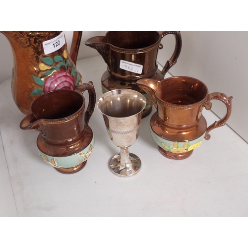 122 - Four copper lustre Jugs and two Goblets