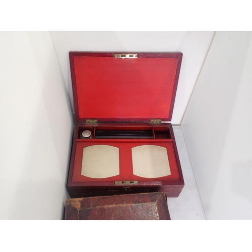 132 - Two antique leather covered Writing Boxes and a red Box with Coat of Arms