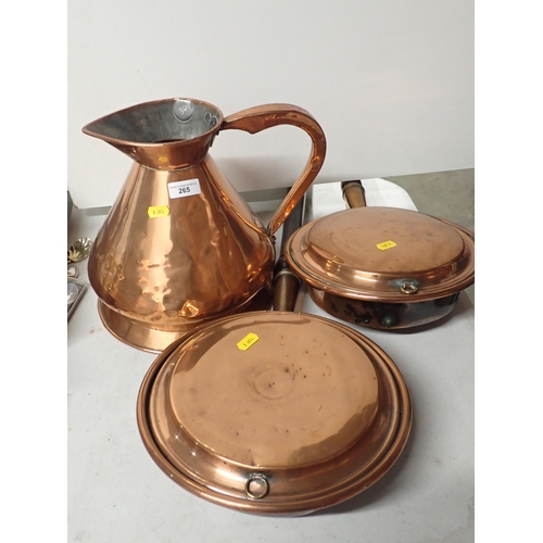 265 - An antique copper Jug and two Warming Pans