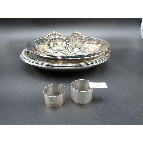 268 - Two silver Napkin Rings, London 1920 and Sheffield 1954, four plated oval Dishes and three handles