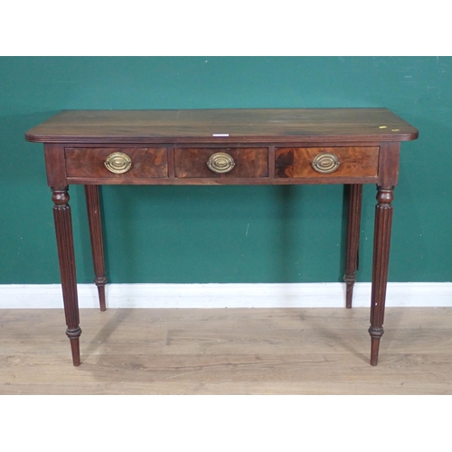 533 - A mahogany Side Table fitted three drawers on fluted tapered supports, 2ft 8