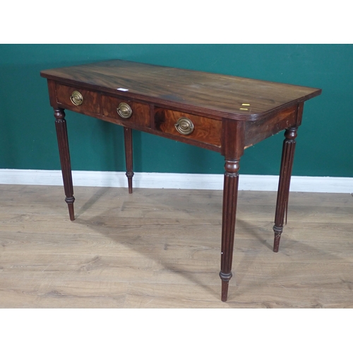 533 - A mahogany Side Table fitted three drawers on fluted tapered supports, 2ft 8