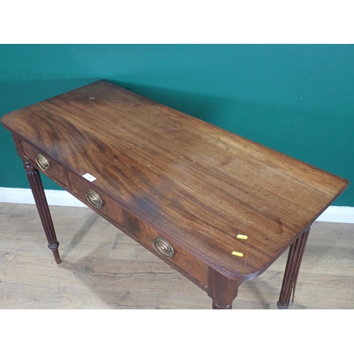 533 - A mahogany Side Table fitted three drawers on fluted tapered supports, 2ft 8