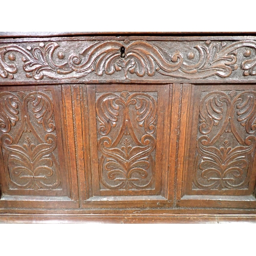 286 - A 17th Century oak Coffer with three panel sunken lid above leafage carved frieze and three carved p... 