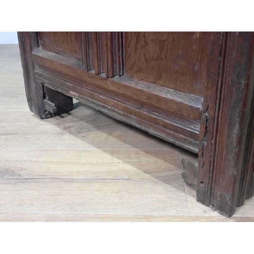 289 - A 17th Century oak Coffer with five panel sunken lid above four panel front mounted on double channe... 