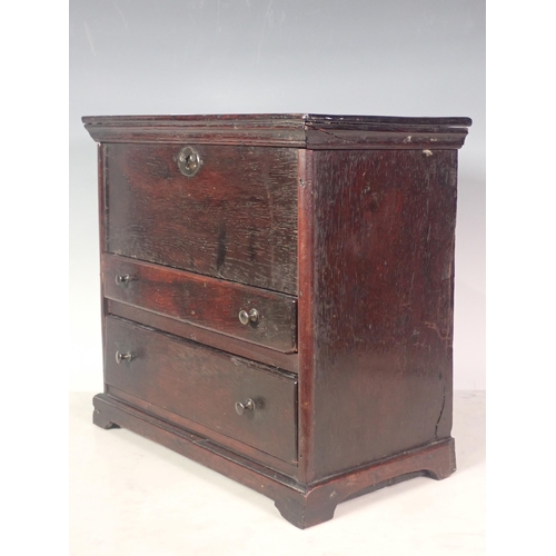 292 - An 18th Century red walnut Apprentice Chest with hinged lid above two drawers on bracket feet, 32