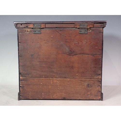 292 - An 18th Century red walnut Apprentice Chest with hinged lid above two drawers on bracket feet, 32