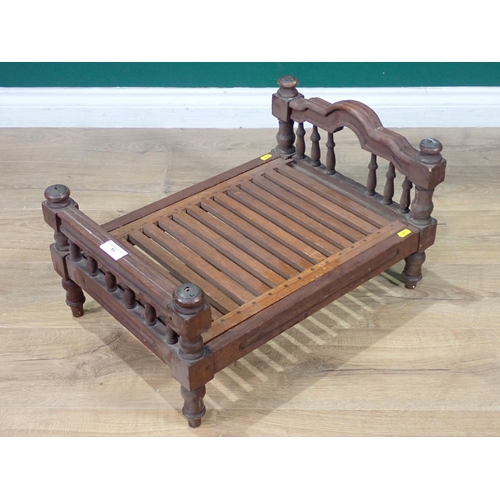 11 - A wooden Dolls Bed with carved and turned head and footboards, 21