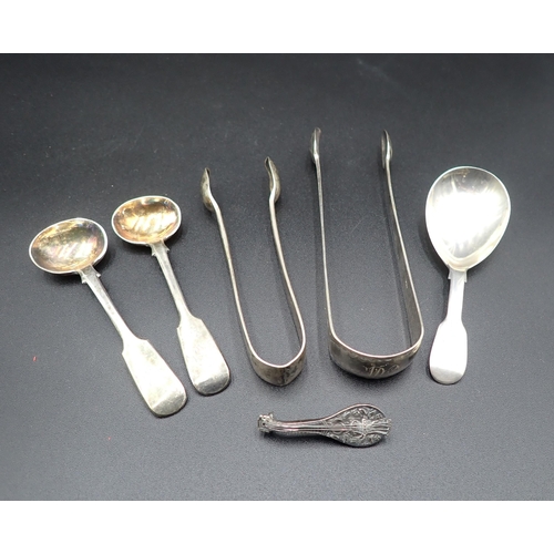 123 - A George IV silver Caddy Spoon, fiddle pattern, London 1829, a pair of Salt Spoons, London 1912, a V... 