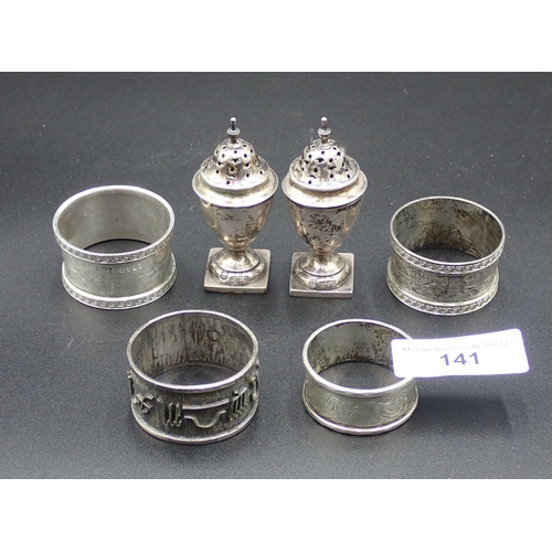 141 - A pair of Edward VII silver urn shape Pepperettes on square bases, Chester 1905, and four various Na... 