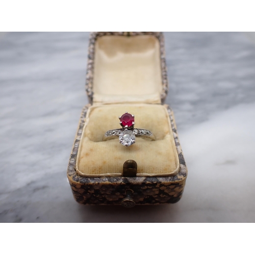 158 - An early 20th Century Ruby and Diamond Ring claw-set single round ruby above old-cut diamond with tr... 