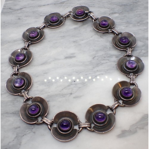 172 - A 1960's Danish Amethyst Necklace having circular links each close-set round cabochon by Danske Guld... 