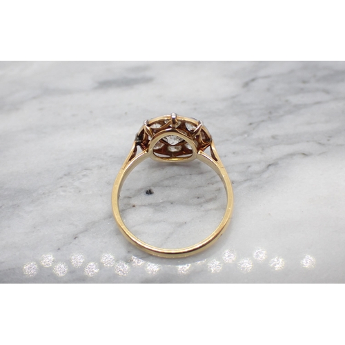 173 - A Diamond Cluster Ring pavé-set old-cut stone within frame of eight smaller stones, ring size K 1/2