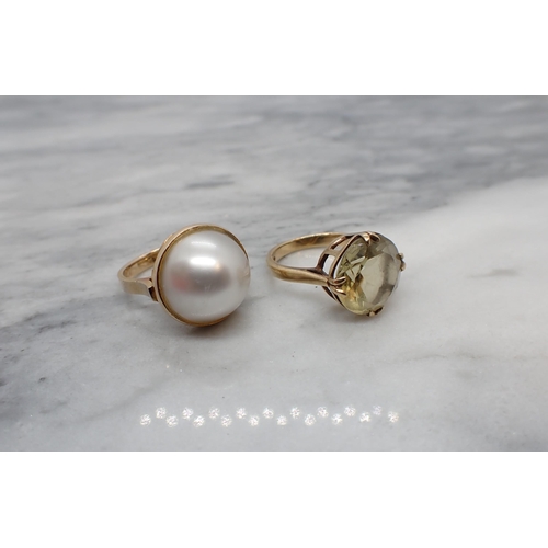 186 - A Mabé Pearl Ring stamped 14K, ring size I and a Citrine Dress Ring claw-set round stone in 9ct gold... 