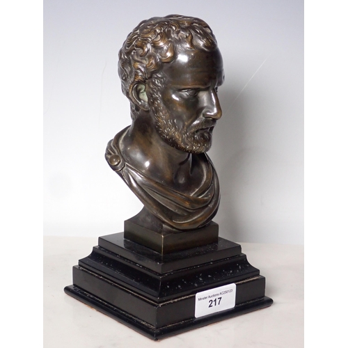 217 - A bronze Bust of a bearded Man mounted on a stepped ebonised base, 8in H overall