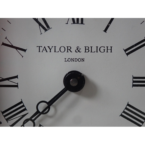 223 - A brass cased Carriage Clock by Taylor & Bligh, London, the circular dial surrounded by filligree ty... 