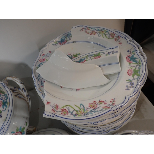 245 - A Felspar part Dinner Service including a turkey dish, covered tureen, dishes and plates, some worn ... 