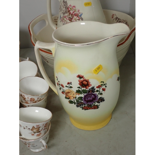 265 - A floral patterned Toilet Jug and Bowl, a Toilet Jug, and a Colclough part Tea Set